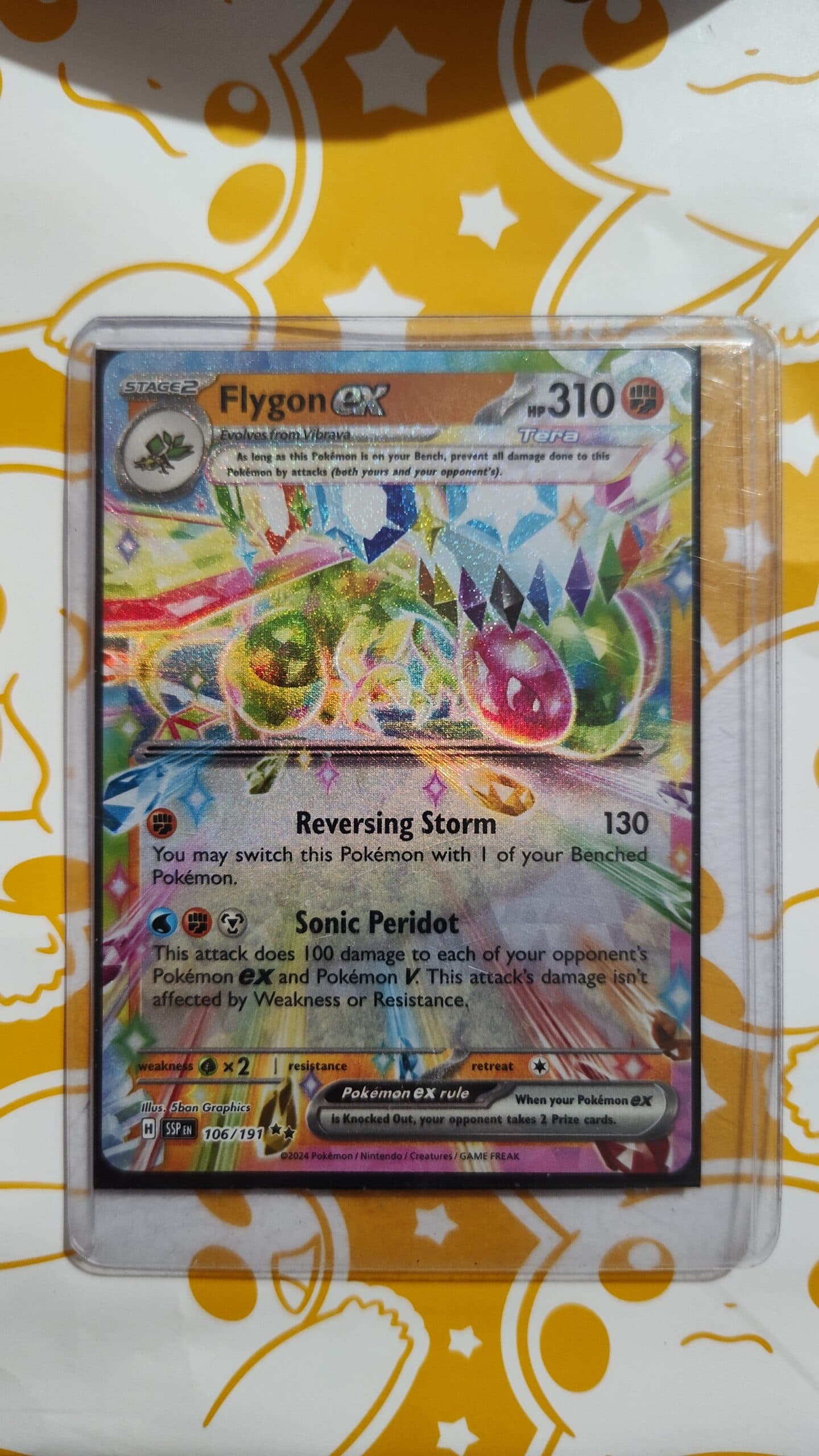 Flygon ex (Tera) – Surging Sparks #106/191